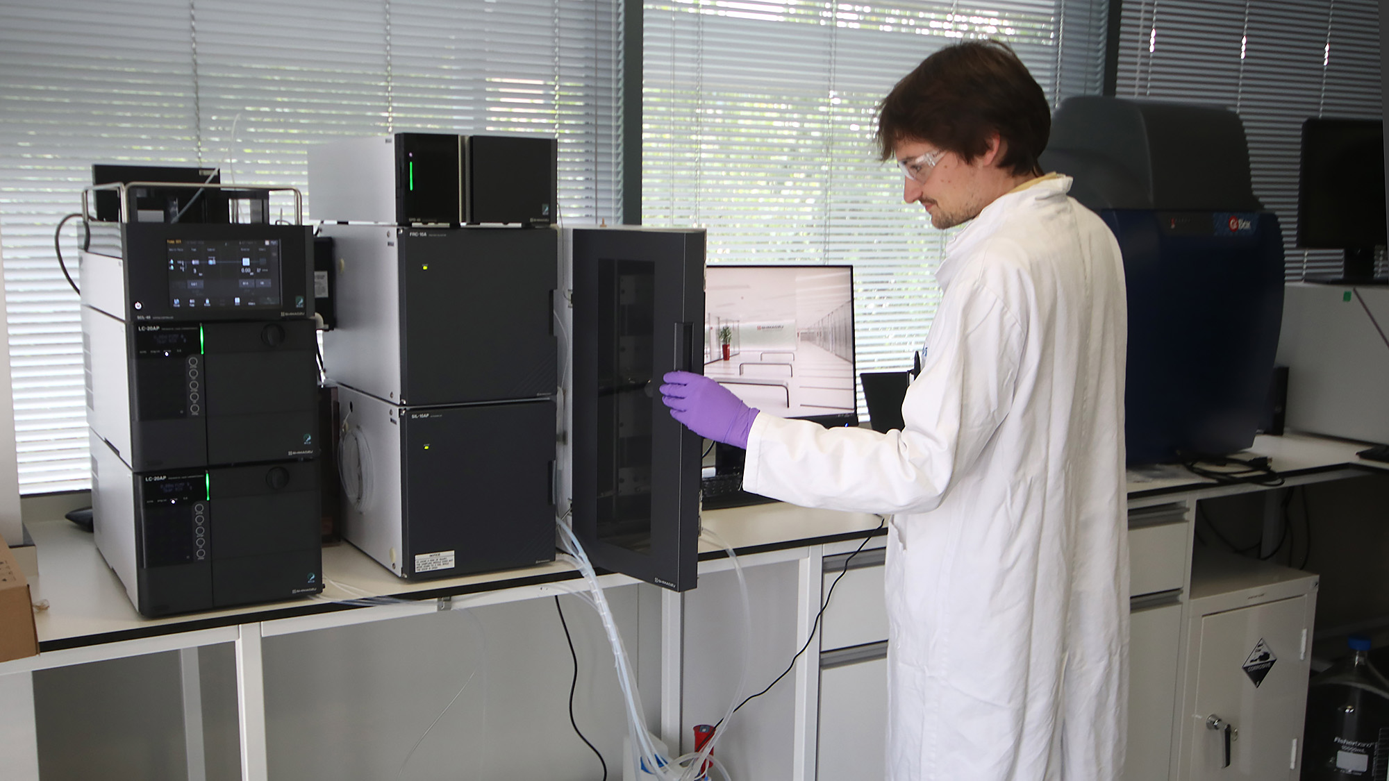 Quentin Vicentini with a Shimadzu Nexera preparative HPLC system